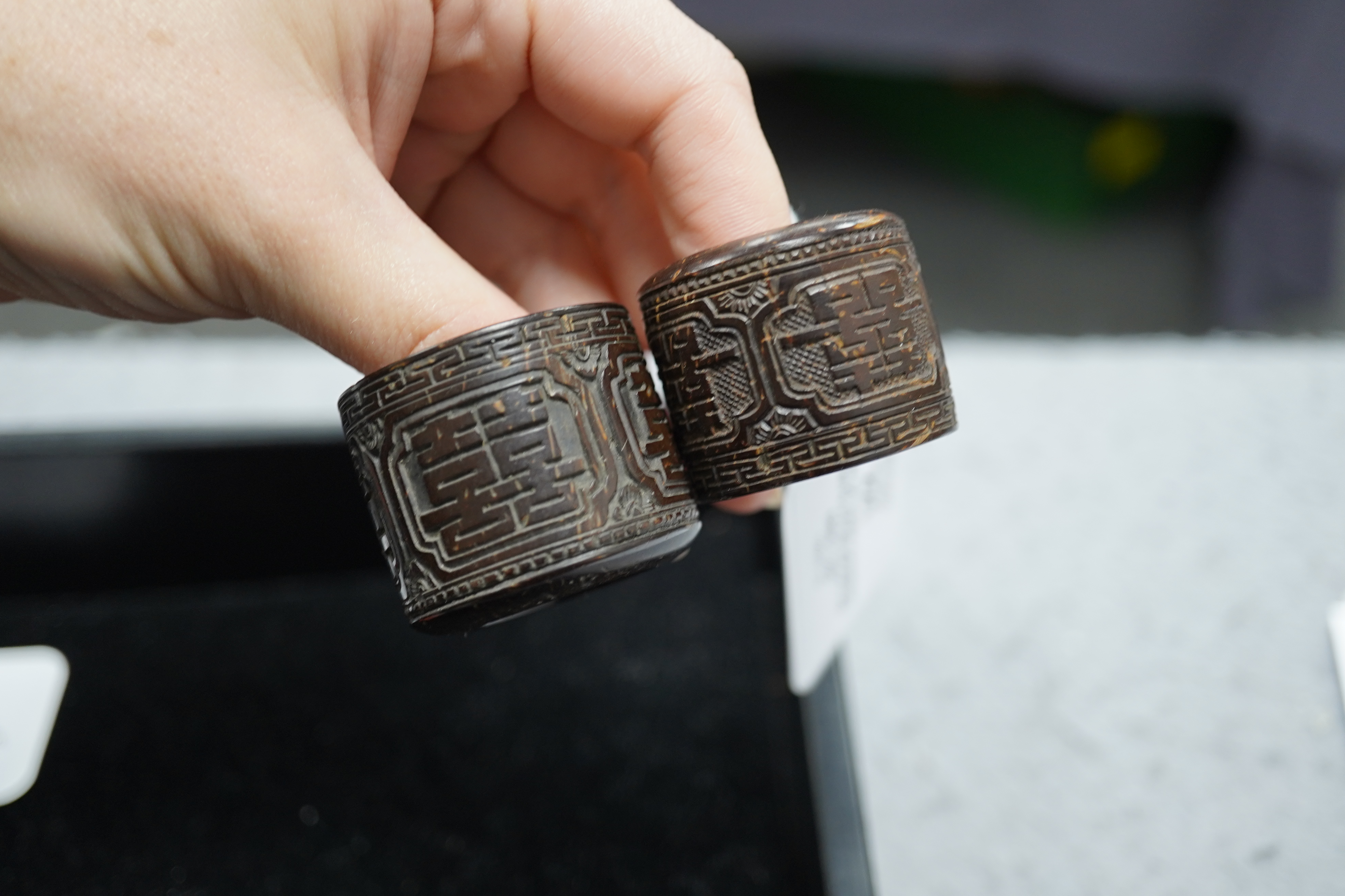 A pair of rare Chinese Straits palm wood archer's thumb rings, 19th century